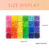 A display of various colored pony beads and letter beads in small plastic compartments.