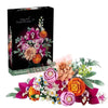 A box of Pretty Pink Flower Bouquet building blocks featuring various artificial flowers in shades of pink, orange, and green