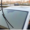 Close-up view of a black rubber seal strip installed on a car window or sunroof.