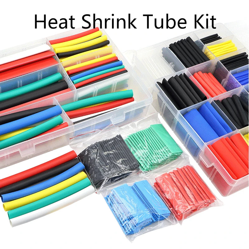 A collection of various colored heat shrink tubing kits, including black, red, yellow, blue, and green tubes.