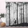 A black and white fabric shower curtain featuring a dense forest scene with tall trees and a deer silhouette.
