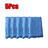 Five blue microfiber scrubbing sponges stacked together.