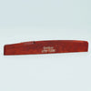 A wooden acoustic guitar bridge saddle with the name Guyker ATR-7230 engraved on it.