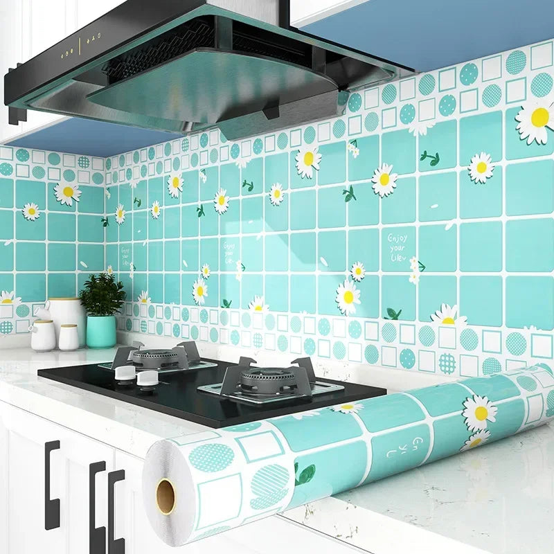 A kitchen splashback tiled with light blue and white floral patterns, featuring a self-adhesive wallpaper roll.