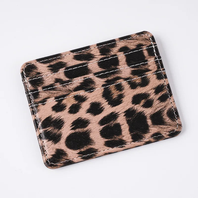 A brown and black leopard print PU leather card wallet shown from above.