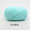A ball of light blue soft 4-ply milk cotton yarn for knitting and crochet.