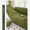 A deep olive green stretch jacquard sofa cover with a textured fabric and non-slip elastic edge.
