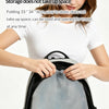 A woman is holding a compact gray mosquito net storage bag, demonstrating its foldable design.