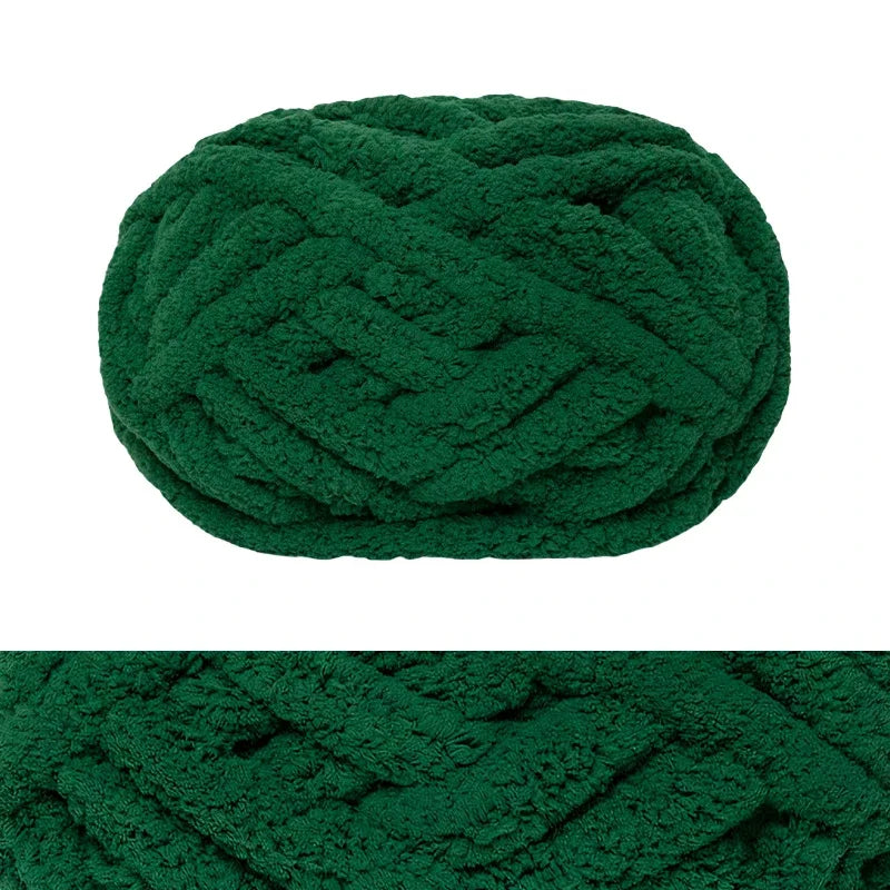 A ball of dark green chunky chenille yarn for hand knitting and crochet