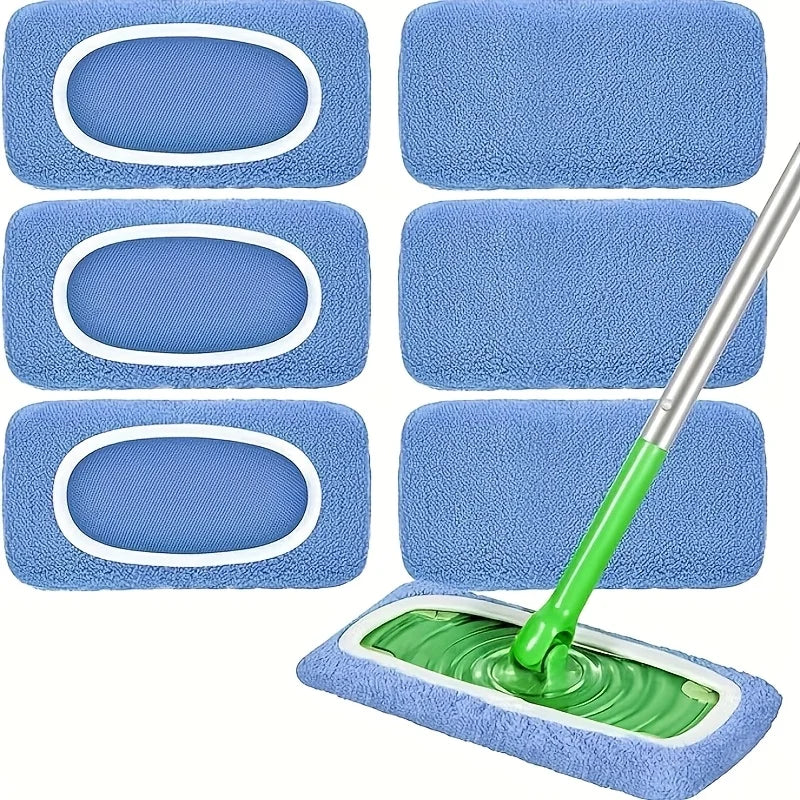 A set of three blue reusable mop pads with white borders and a green handle for cleaning.