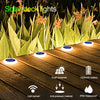 Solar deck lights installed on wooden planks, featuring a light sensor and IP68 waterproof rating.