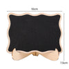 A small wooden chalkboard sign with a black surface and light wood frame, measuring 10cm by 7.5cm.