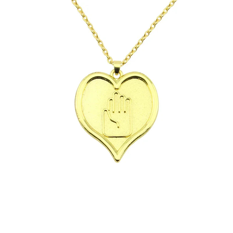 Gold heart pendant necklace featuring a hand symbol, part of JoJo's Bizarre Adventure Red Stone of Aja.