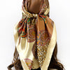A square scarf featuring a leopard print and paisley pattern in shades of brown, gold, and green silk.