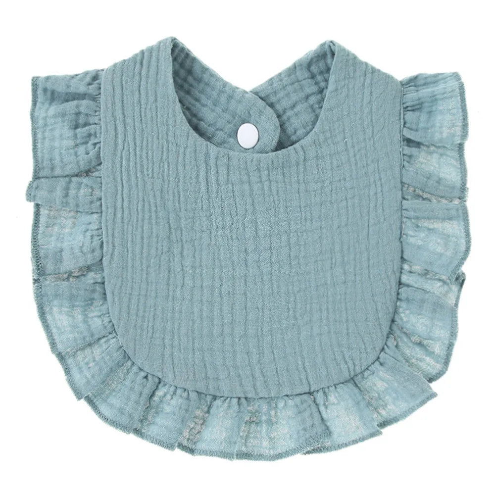 Light blue ribbed cotton baby bib in a bandana style with ruffled edges