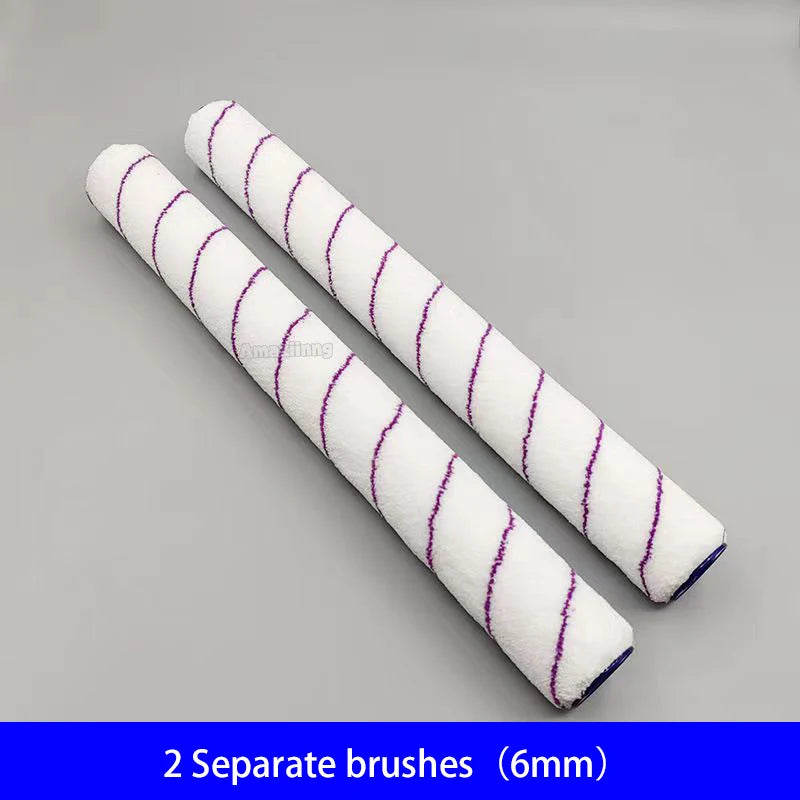 Two white paint brushes with purple stripes are shown diagonally on a gray background.