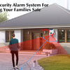 A home security alarm system featuring a solar motion sensor, siren, and flashing light installed on the exterior of a house.