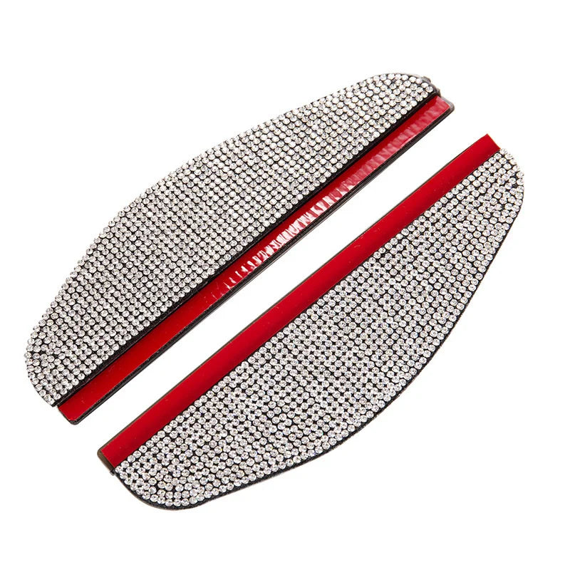 A pair of rhinestone car rearview mirror rain guards with red accents.