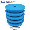 A set of five blue polishing sponge pads for car detailing and paint correction.