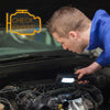 A person is using an oil change neon sign to check the engine of a car.