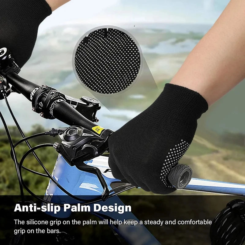 Close-up of a hand wearing anti-slip knitted work gloves gripping bicycle handlebars.