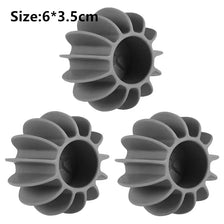 A set of six reusable laundry balls for pet hair and lint removal, gray color.