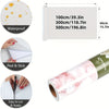 Roll of self-adhesive marble wallpaper in green and pink tones showing various usage and size options.