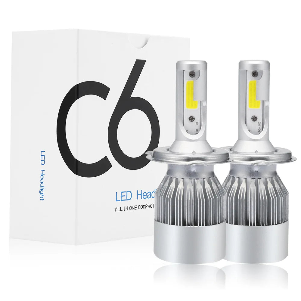 A box and two LED headlight bulbs are shown, featuring a silver housing and yellow light.