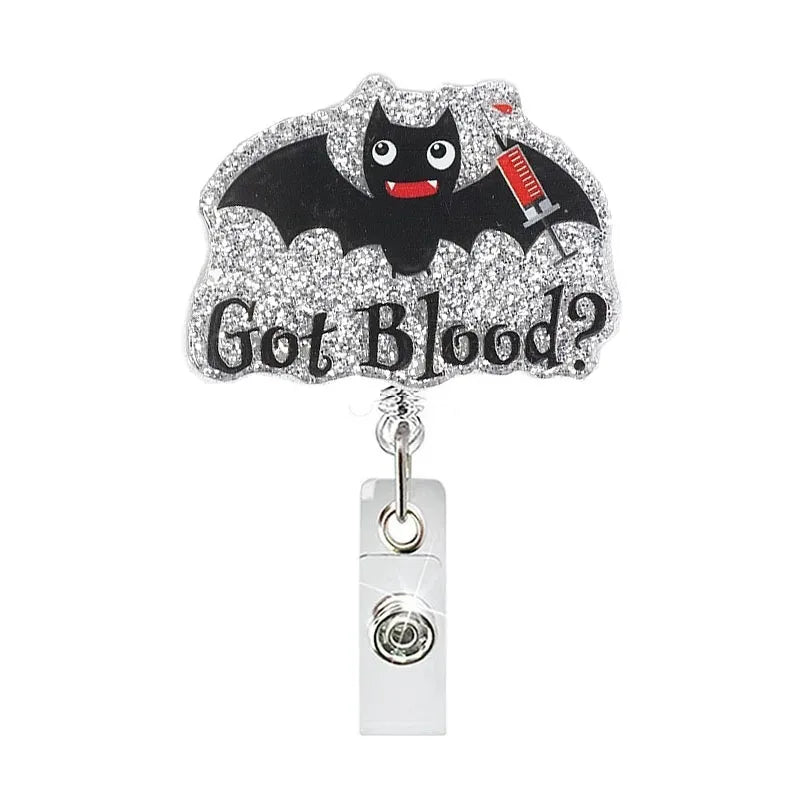 Glitter acrylic batshaped badge reel with the text Got Blood?
