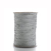 A spool of gray waxed cotton cord used for jewelry making