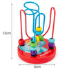 A set of red and blue wooden puzzles shaped like an elephant, featuring colorful rings for toddlers.