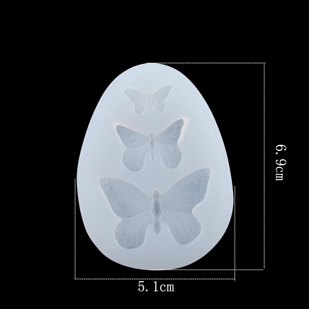 A white epoxy resin mold shaped like a butterfly for DIY jewelry making.
