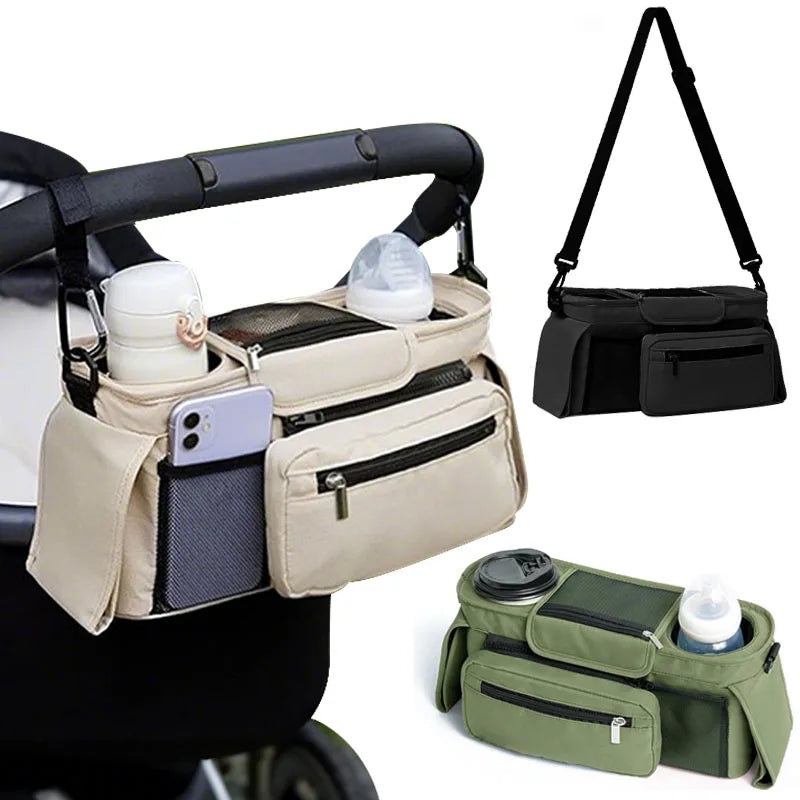 A beige stroller storage organizer bag with multiple pockets and hanging straps is shown next to a green version.