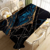 Black gold marble waterproof tablecloth displayed on a table with white chairs and natural light.