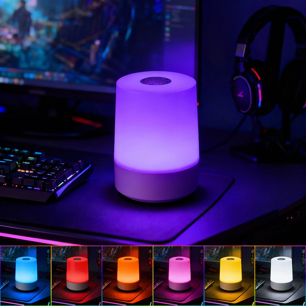 Various colored modern LED cylinder night lights displayed on a dark surface.