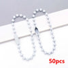 A string of small white ball beads is displayed on a white background, showing various lengths and a bead with a slit.