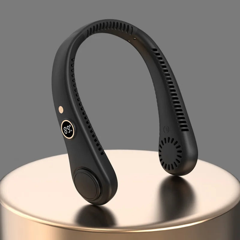 A black hands-free bladeless neck fan with a digital display is shown on a light surface.