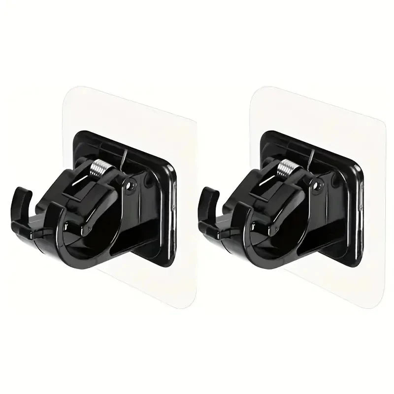 A set of two black self-adhesive no-drill curtain rod brackets for mounting curtains.