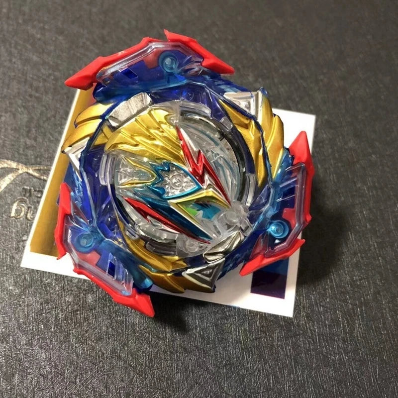 A metal battle spinning top featuring red and blue components with a gold center, displayed on a white card.