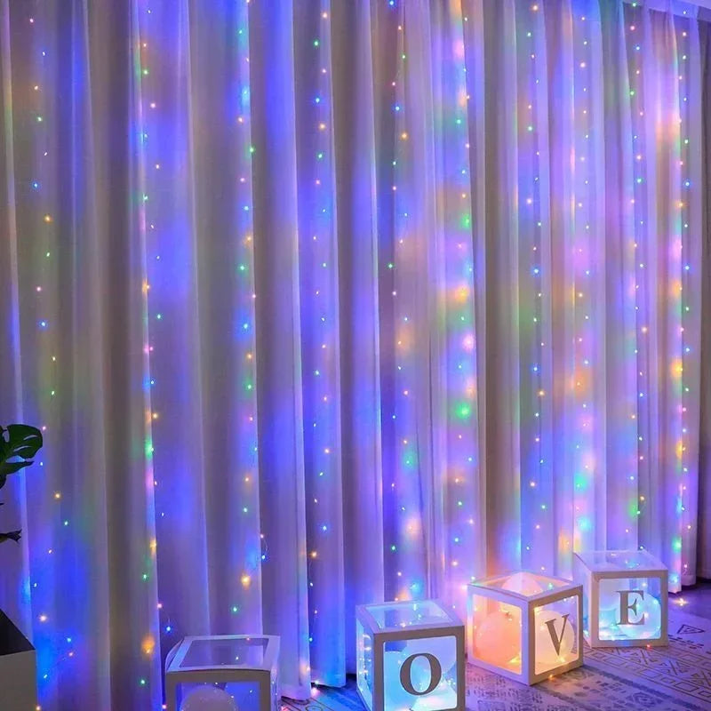 Purple and pink LED curtain lights illuminating a draped background for event decor