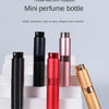 Three-section rotation mini perfume bottle in black and rose gold colors displayed on white steps