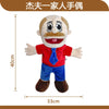 A soft plush hand puppet of a zombie boy with light hair, wearing a red shirt and blue pants.
