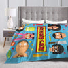 A colorful throw blanket featuring cartoon characters like Bob's Burgers, suitable for home decor.