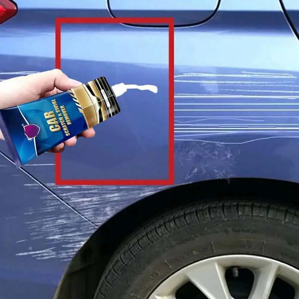 A hand holds a bottle of Car Scratch Remover & Paint Polish Paste on a blue car surface.