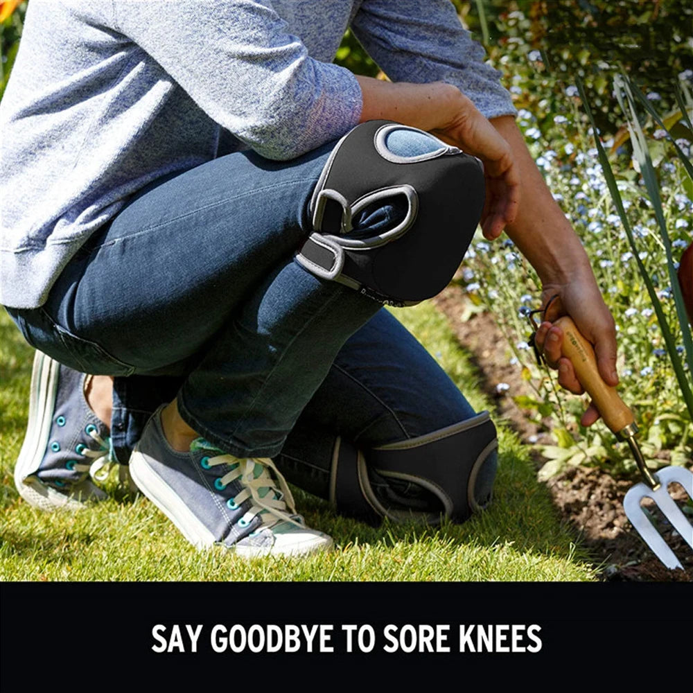 A person wearing dark jeans is shown using a black soft foam kneepad on their knee while gardening.
