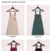 A set of professional chef aprons in off white, light green, maroon, and black colors displayed on hangers.