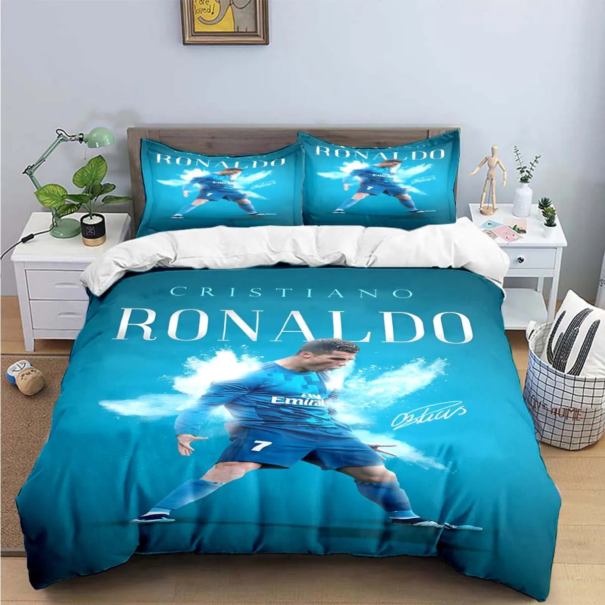 A blue duvet cover featuring a soccer player in action and the name Ronaldo