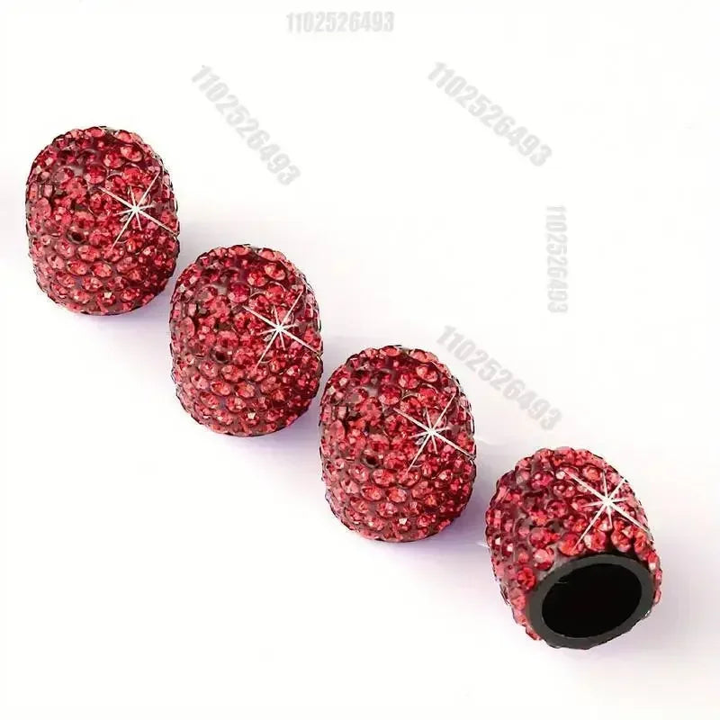 Ein Set von Kristall-Diamant-Radventil-Kappen in tiefroter Farbe.