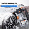 A hand is using a silver electric foam pot to apply blizzard foam onto a car wheel during washing.