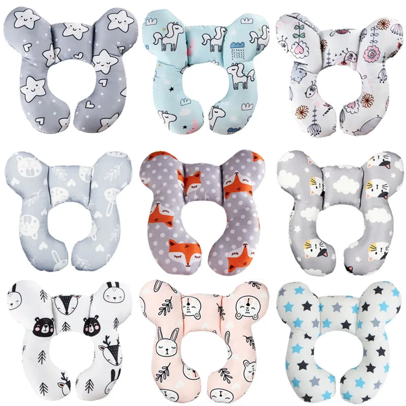 A collection of baby car seat head and neck support pillows in various gray and white patterns.